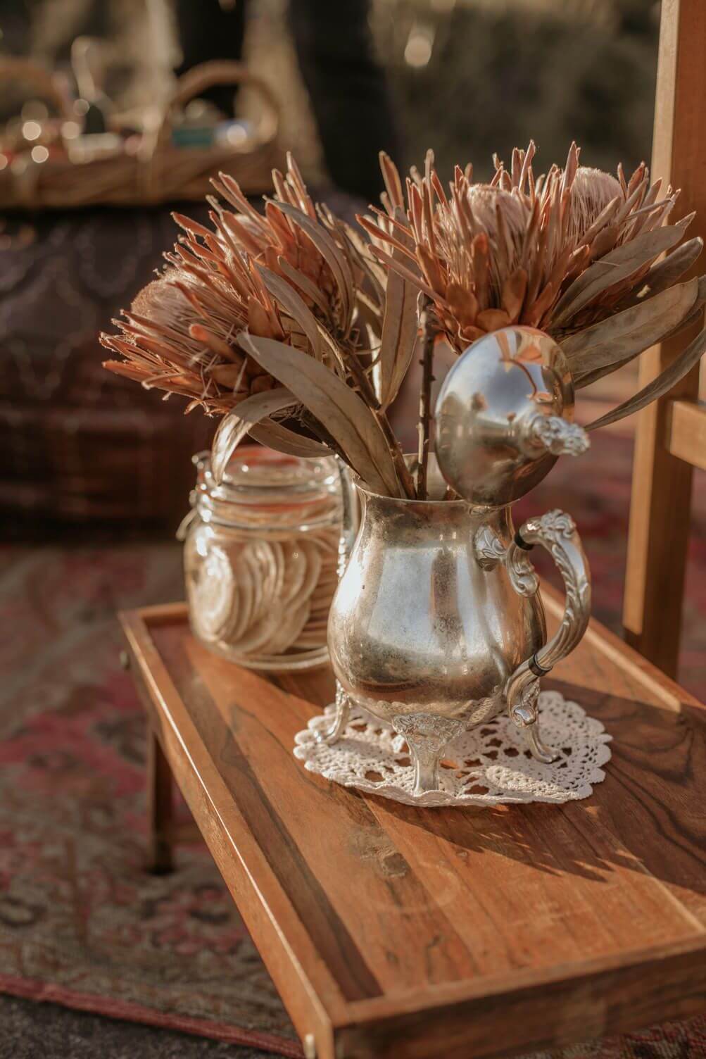 luxury picnic spread featuring vase of natives in national park