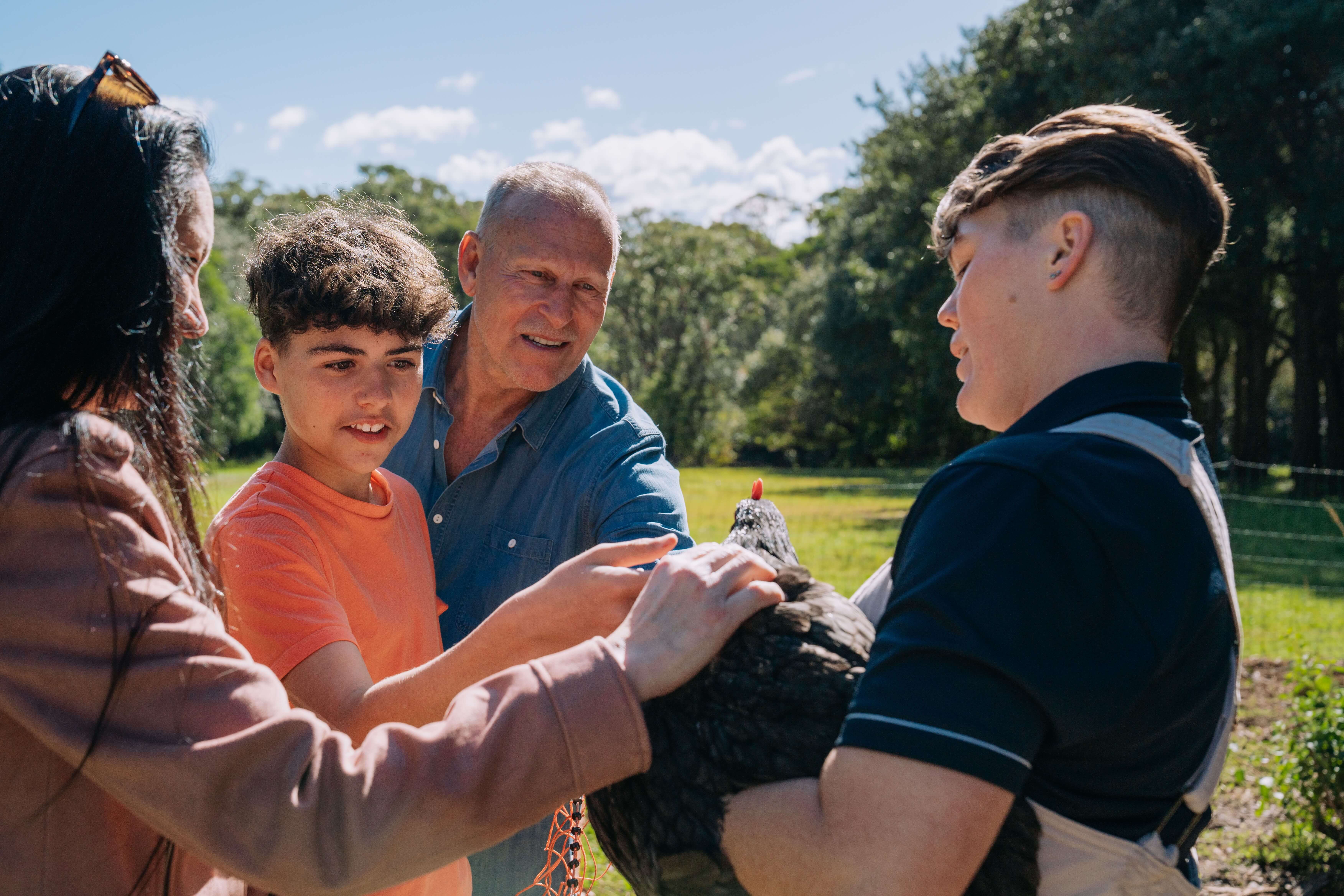 family pet on site chicken held by the head horticulturalist