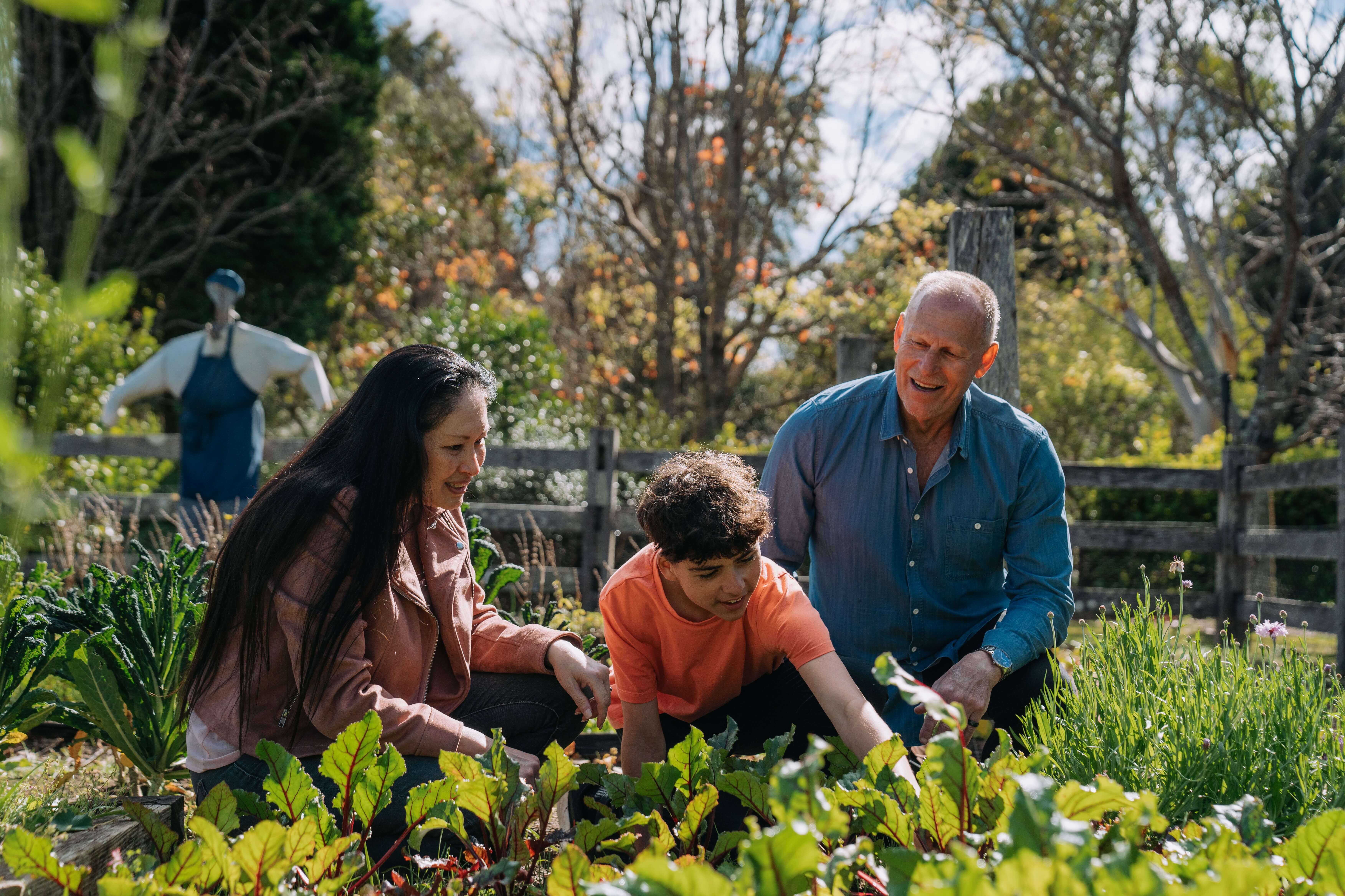 Three guests exploring the onsite garden