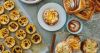 table covered with fresh baked pastries
